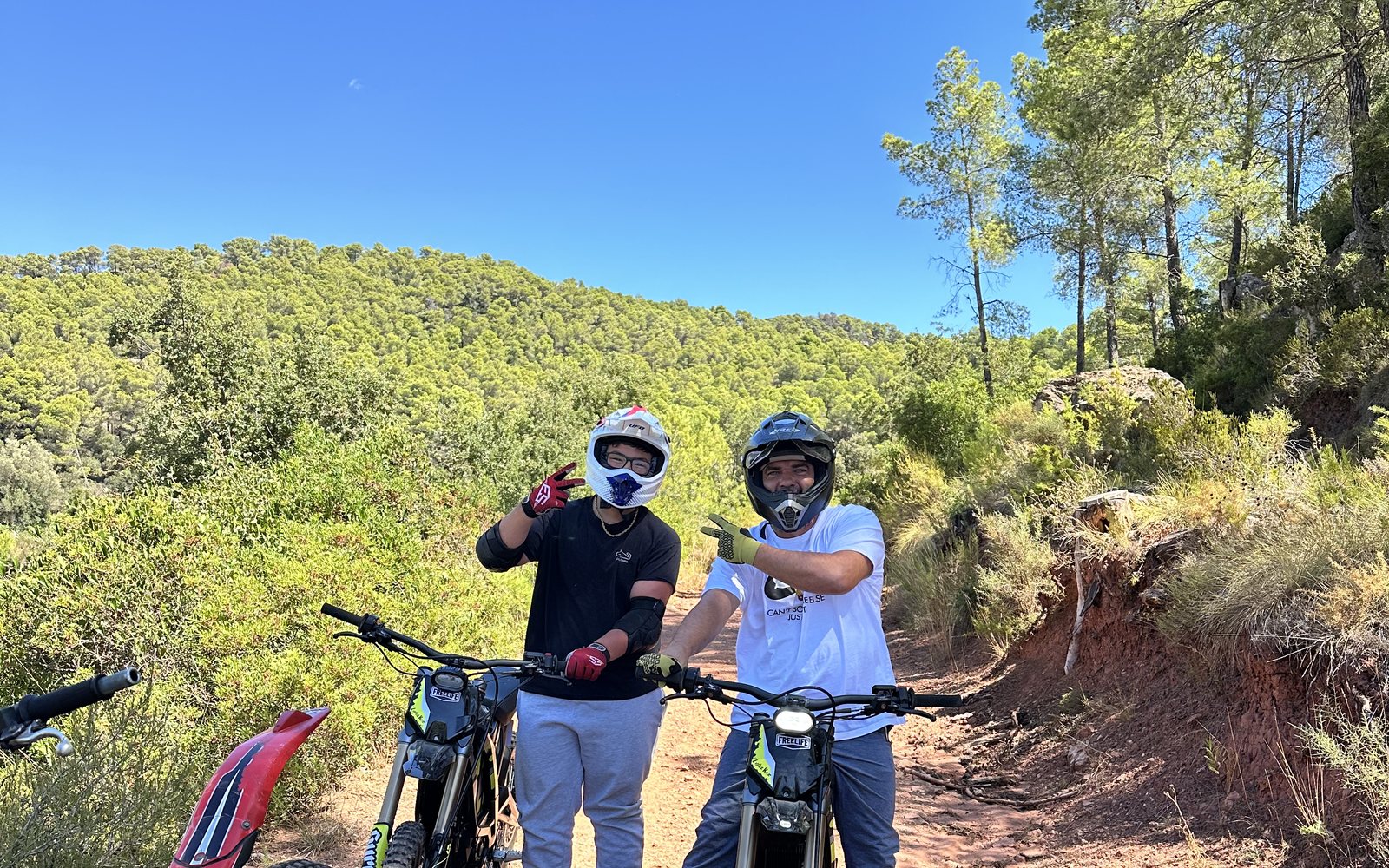 Two riders stopped on a trail through the scrub on the private estate near Tarragona